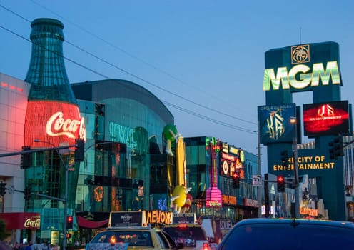 Las Vegas, USA - May 31, 2007: people enjoy the night view from the Strip to the Eiffel tower, Paris Paris and Ballys casino.
