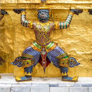 Bangkok, Thailand - December 26, 2007: guard dressed as damon carrying the temple wall in the4 grand palace in Bangkok, Thailand