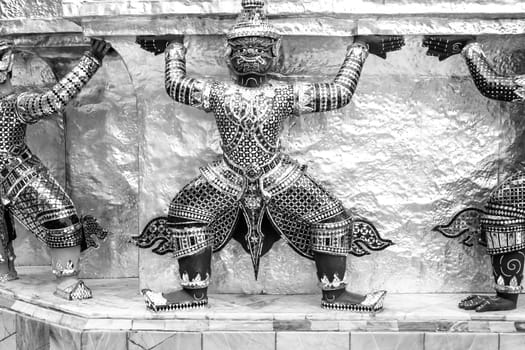 Bangkok, Thailand - December 26, 2007: guard dressed as damon carrying the temple wall in the4 grand palace in Bangkok, Thailand