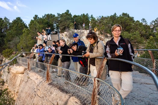 Grand Canyon, USA - July 9, 2008: people watch the spectacular sunset at Grand Canyon.