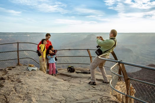 Grand Canyon, USA - July 9, 2008: people watch the spectacular sunset at Grand Canyon.