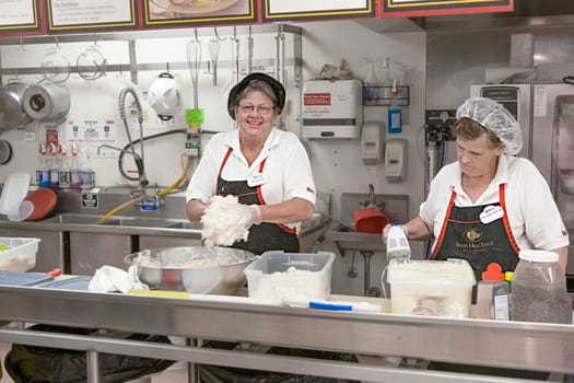 Hurricane, USA - July 17, 2008: supermarket employees in a supermarket selling sandwiches and sweets to tourists in Hurricane, USA.