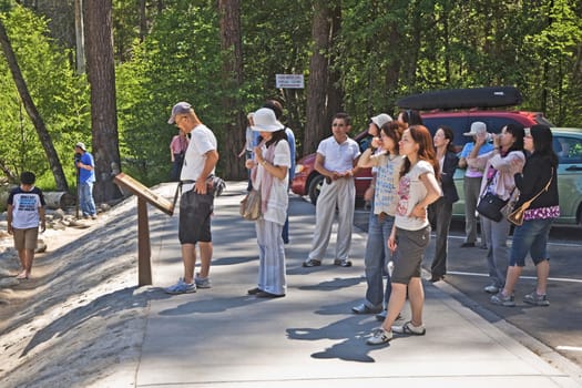 Yosemite national Park, USA - July 22, 2008: people enjoy the yosemite valley by a guided bus tour.