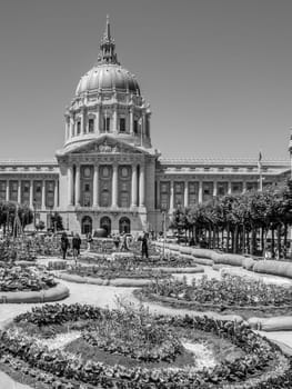 San Francisco, USA - July 23, 2008: people visit the garden in front of City Hall in San Francisco, USA. San Francisco City Hall is the seat of government for the City and County of San Francisco.