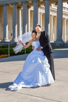 San Francisco, USA - July 23, 2008: wedding couple poses in front of the honor of legion for a wedding photo.