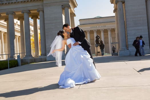 San Francisco, USA - July 23, 2008: wedding couple poses in front of the honor of legion for a wedding photo.