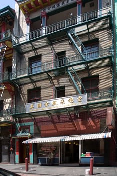 San Francisco, USA - July 24, 2008:  iron fire escape is used for drying clothes in Chinatown  in San Francisco, USA. San Francisco Chinatown is the largest Chinatown outside of Asia.