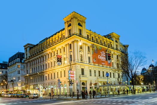 Vienna, Austria - March 23, 2009: facade of historic building with casino in the firt district in Vienna with metro station by night.