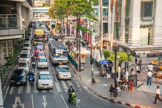 Bangkok, Thailand - May 6, 2009: aerial view to mopeds, cars and a bus in the streets of Bangkok in the typical traffic jam.