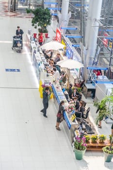 Bangkok, May 6, 2009: passengers arrive at airport Suvarnabhumi wand hurry to the exit.