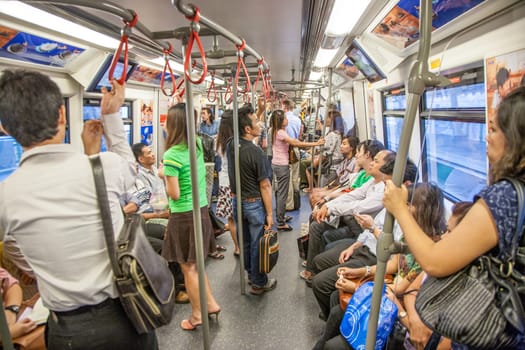 Bangkok, May 6, 2009: people in the metro travel in Bangkok with the skytrain system in the city.