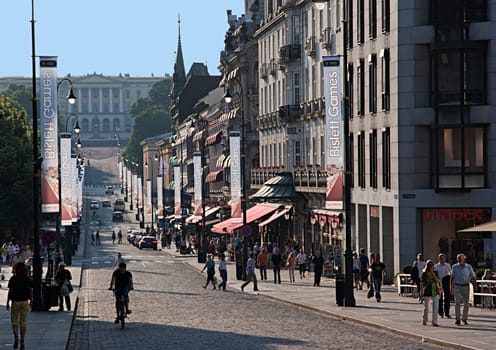 Oslo, Norway - July 2, 2009: people visit the old part of Oslo with cobble stone street and historic buildings. Oslo ist the capital of Norway.