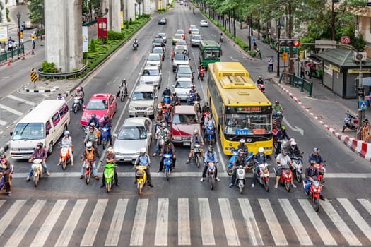 Bangkok, Thailand - May 6, 2009: aerial view to cars stop at a traffic light and wait for green light at Sukhumvit road in Bangkok. Traffic jam is a major transportation problem in Bangkok..