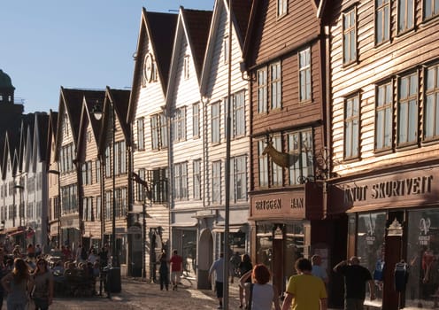 Bergen, Norway - July 3, 2009: Famous Bryggen street with wooden colored houses in Bergen, Norway, UNESCO world heritage site