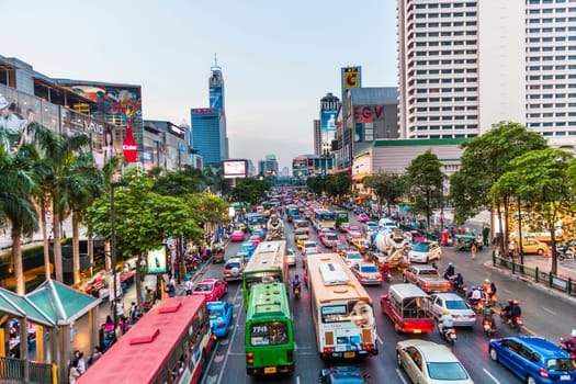 Bangkok, Thailand - May 7, 2009: Bangkok cityscape and traffic in sunset with illuminated cars and buildings. Bangkok is famous for its heavy traffic in the city centre.