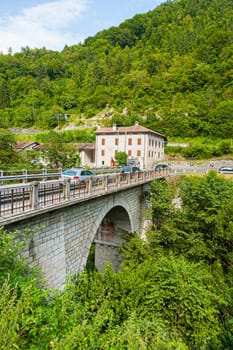 Belluno, Italy - August 2, 2009: old abandoned hotel at the Serra Bridge in Belluno, Italy. The old small roads are nearly abandoned due to the Brenner highway.