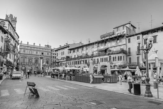 Verona, Italy - August 4, 2009:  people visit the old medieval town of Verona in late afternoon in summer time.