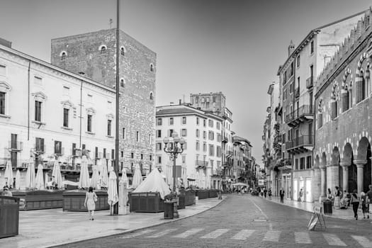 Verona, Italy - August 4, 2009:  people visit the old medieval town of Verona in late afternoon in summer time.