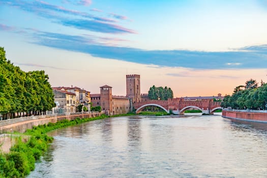 skyline of verona with river adige and old roman bridge in sunset