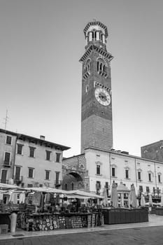 Verona, Italy - August 4, 2009:  people visit the old medieval town of Verona in late afternoon in summer time.