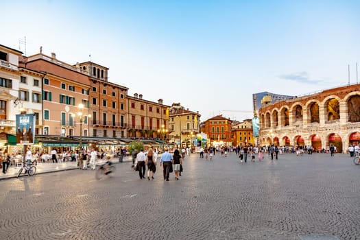 Verona, Italy - August 4, 2009: people enjoy the evening at Piazza Bra at the old roman Amphitheater in Verona, Italy.