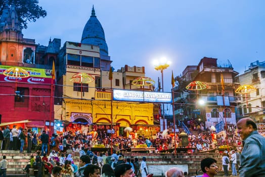 Varanasi, India - December 10, 2009: Hindu people celebrate at Dashaswmedh ghat at river Ganga in the holy city of Varanasi. The holy ritual of washing is held every day in Varanasi, India.