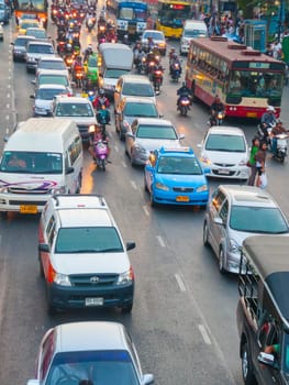 Bangkok, Thailand - December 22, 2009: main road in Bangkok in afternoon traffic jam with cars near the CENTRAL shopping center, Sukhumvit in Bangkok, Thailand.