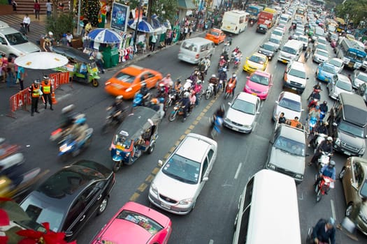 Bangkok, Thailand - December 22, 2009: main road in Bangkok in afternoon traffic jam with cars near the CENTRAL shopping center, Sukhumvit in Bangkok, Thailand.