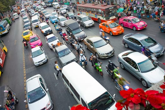 Bangkok, Thailand - December 22, 2009: main road in Bangkok in afternoon traffic jam with cars near the CENTRAL shopping center, Sukhumvit in Bangkok, Thailand.