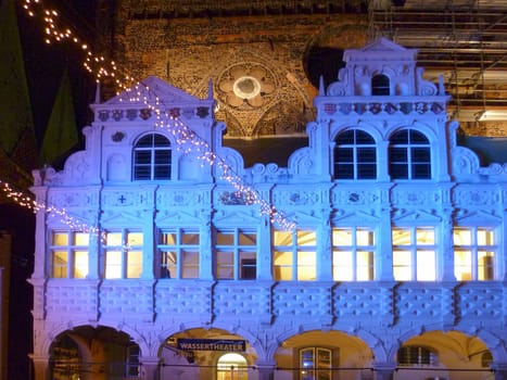 Luebeck, Germany - January 2, 2010:  beautiful view to told town hall in Luebeck, illuminated by night in blue.