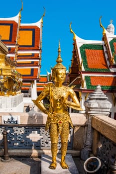 Bangkok, Thailand - January 4, 2010: a kinnari, a mythology figure, is watching the temple in the Grand Palace.