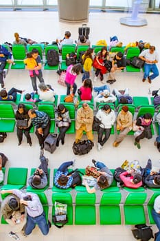 Bangkok, Thailand - January 5, 2010: passengers wait at the departure gate for the boarding call of their flight in the new Bangkok airport Suvarnabhumi.