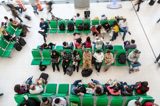Bangkok, Thailand - January 5, 2010: passengers wait at the departure gate for the boarding call of their flight in the new Bangkok airport Suvarnabhumi.