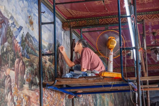 Bangkok, Thailand - January 4, 2010: mural art painter renovates the painted wall in the grand Palace, Bangkok.