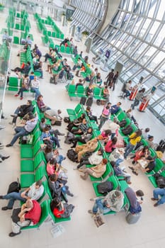 Bangkok, Thailand - January 5, 2010: passengers wait at the departure gate for the boarding call of their flight in the new Bangkok airport Suvarnabhumi.