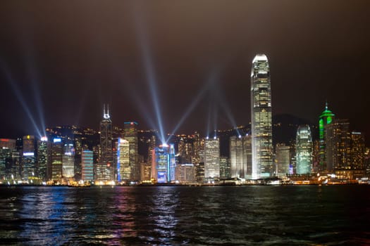 Kowloon, Hongkong - January 07, 2010: view during Hong Kong Harbor Laser Show to Skyline of Victoria by night, Kowloon, Hongkong