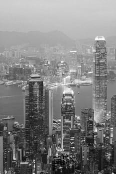 Victoria, Hong Kong - January 8, 2010: view by night from Victoria peak to the skyline and harbor of Hong Kong with spectacular skyscraper scene.