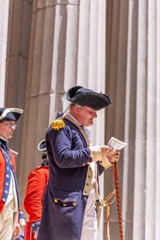 New York, USA - July 9, 2010: Ceremony for declaration of independence in old costumes takes place at the Washington statue in front of federal Hall National Memorial in New York, USA.