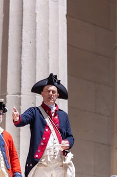 New York, USA - July 9, 2010: Ceremony for declaration of independence in old costumes takes place at the Washington statue in front of federal Hall National Memorial in New York, USA.