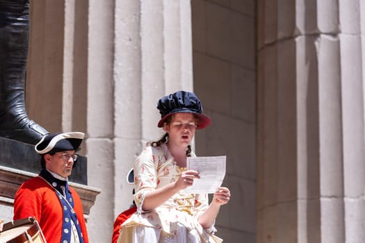 New York, USA - July 9, 2010: Ceremony for declaration of independence in old costumes takes place at the Washington statue in front of federal Hall National Memorial in New York, USA.