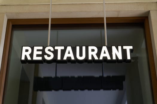 Sign as an indication of a restaurant in the city center of Berlin