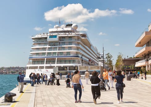 Istanbul, Turkey - May 13, 2023: Viking Sky, a huge luxury cruise ship docked at terminal of Galataport, a mixed use development located along shore of Bosphorus