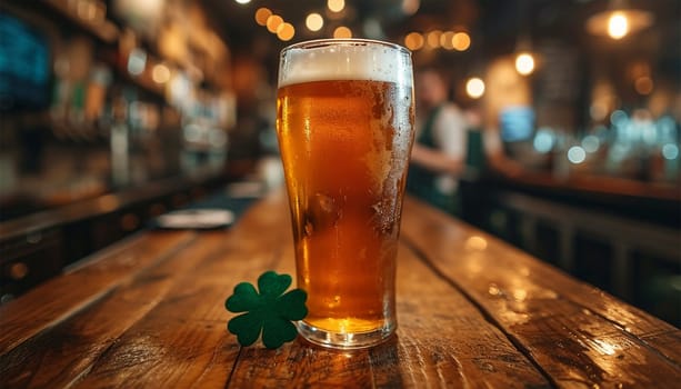 Saint Patrick's day.Glass of beer on bar with four clover leaves. Traditional festival symbols. Shamrock. Glass of beer on bar in pub on wooden table sparkling lights.