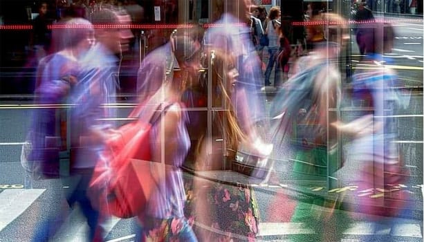 Walking people blur. Lots of people walking in the big City. Wide panoramic view of people crossing the road. colorful summer day. Motion blurred background colors