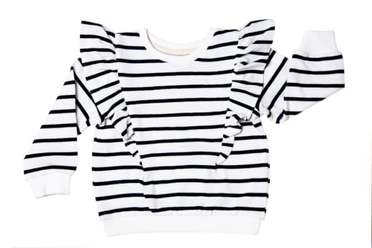 Denim shirt isolated. Closeup of a stylish black white striped shirt or t-shirt for child girl isolated. Clipping path. Kids summer fashion in marine style.