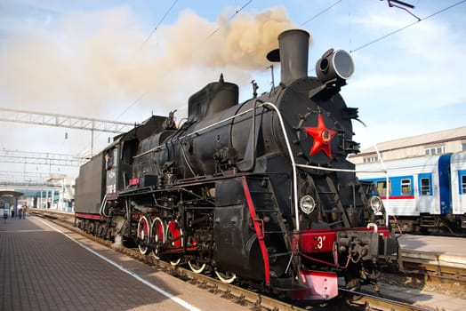 Novosibirsk, Russia - July 20, 2018: Vintage steam locomotive. Open-air museum. locomotive or engine is a rail transport vehicle that provides the motive power for a train.