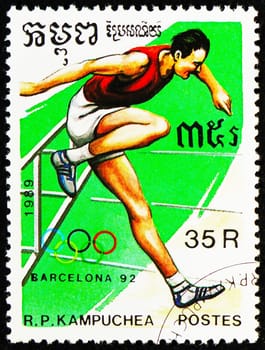 MOSCOW, RUSSIA - OCTOBER 29, 2022: Postage stamp printed in Cambodia shows Hurdles, Summer Olympic Games 1992 - Barcelona (I) serie, circa 1989