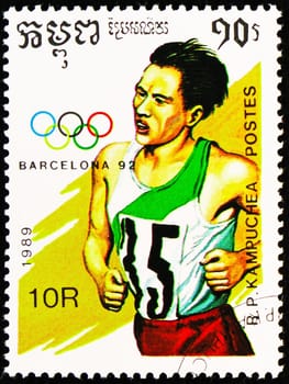 MOSCOW, RUSSIA - OCTOBER 29, 2022: Postage stamp printed in Cambodia shows Running, Summer Olympic Games 1992 - Barcelona (I) serie, circa 1989