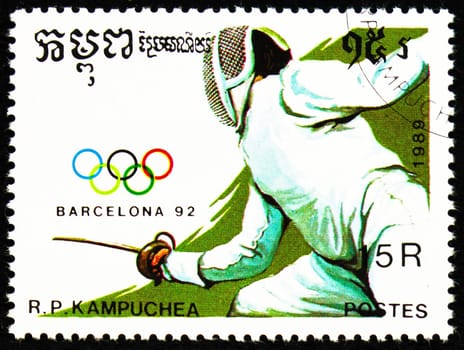 MOSCOW, RUSSIA - OCTOBER 29, 2022: Postage stamp printed in Cambodia shows Fencing, Summer Olympic Games 1992 - Barcelona (I) serie, circa 1989