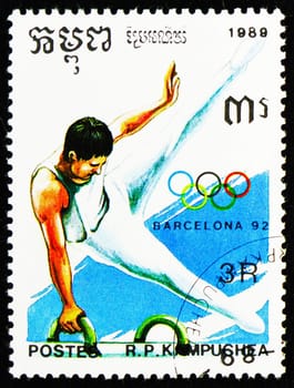 MOSCOW, RUSSIA - OCTOBER 29, 2022: Postage stamp printed in Cambodia shows Pommel horse, Summer Olympic Games 1992 - Barcelona (I) serie, circa 1989